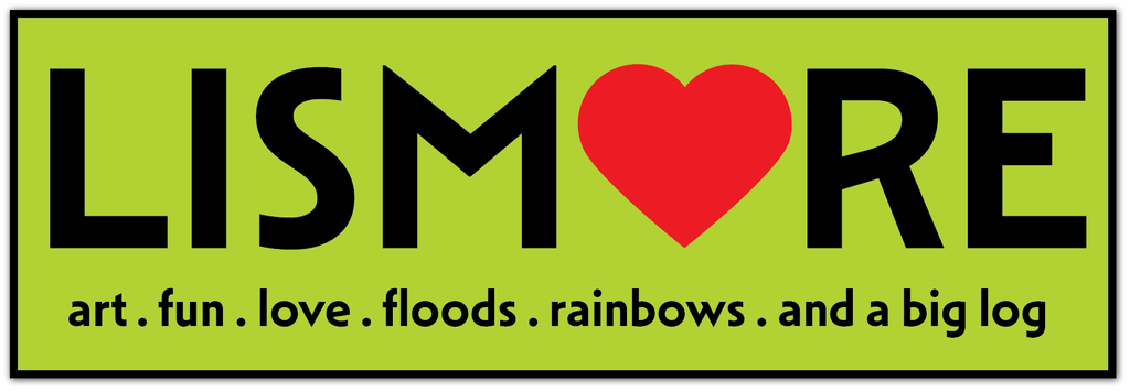 A square graphic with a bright lime green background and a black border. Large black text reads 'LISMORE' across the center, with a red heart replacing the O.