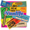 A collage of colorful retro-style metal road signs with humorous camping and travel-themed phrases, featuring the large 'Vanlife' logo prominently across the center.